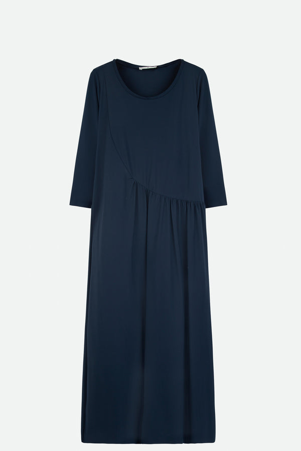 Front view of navy long sleeve scoop neck long dress with roosing in front 